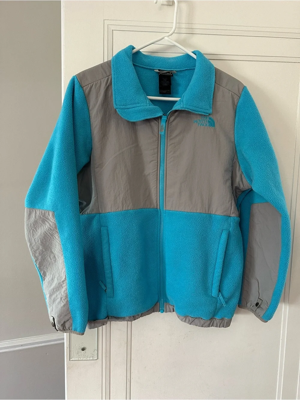 The North Face Bright Turquoise Fleece with Black Tag